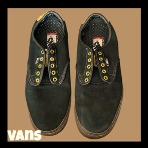 Black suede Vans with gold accents